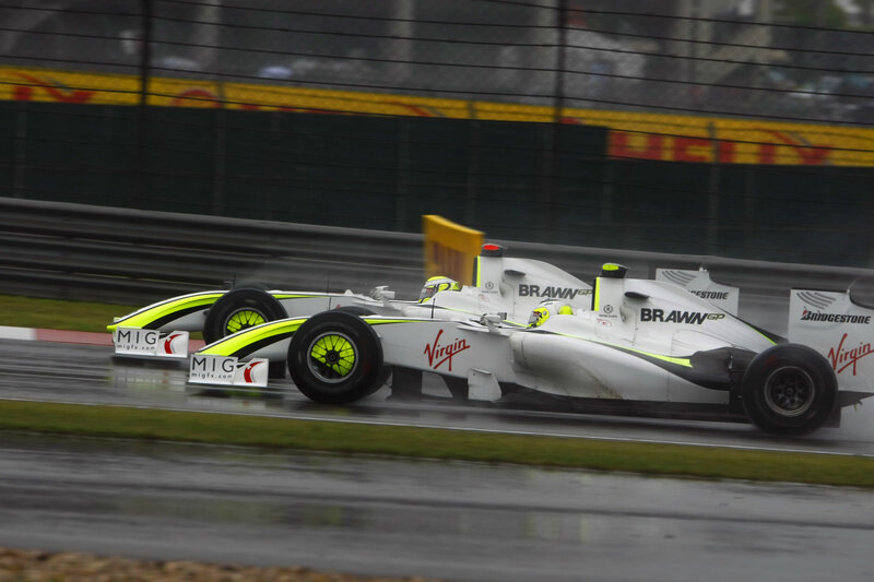 Formula One cars racing in rain