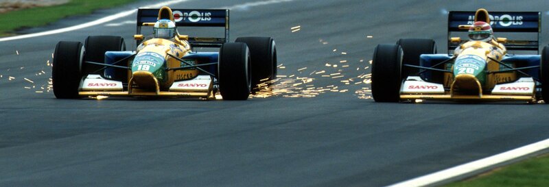 Formula One cars racing on track