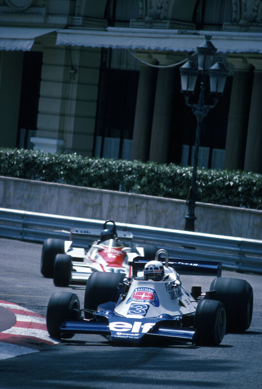 Formula One cars racing on track