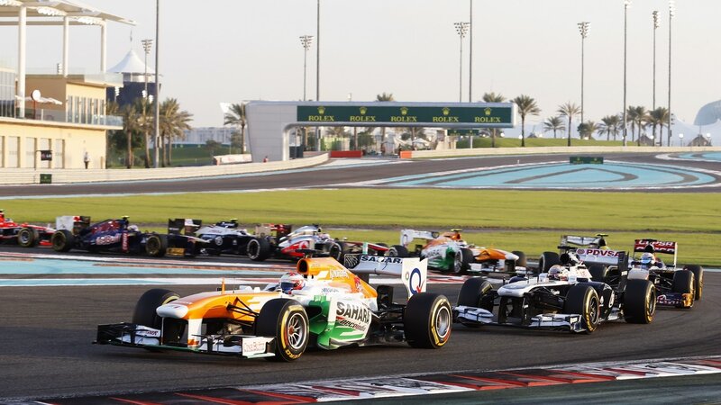Formula One Cars Racing — Orange, Competitive, Afternoon, Photograph, Race Track, Palm Trees