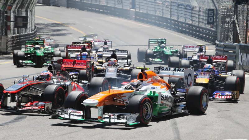 Formula One Cars Racing — Orange, Competitive, Afternoon, Photograph