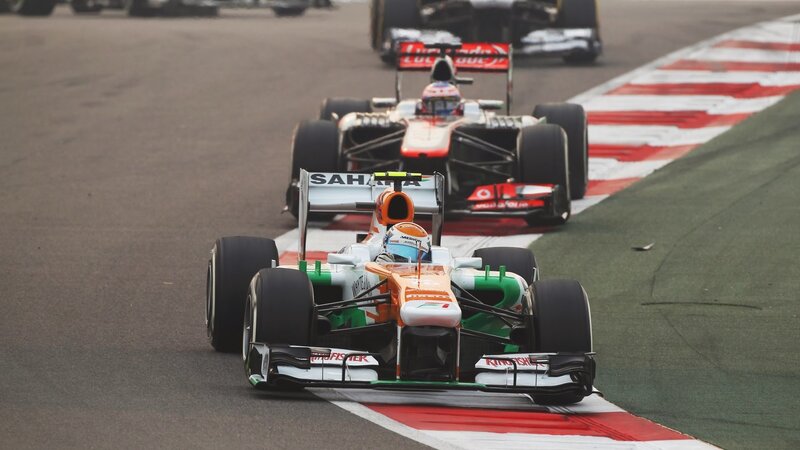 Formula One Cars Racing — Orange, Competitive, Photograph