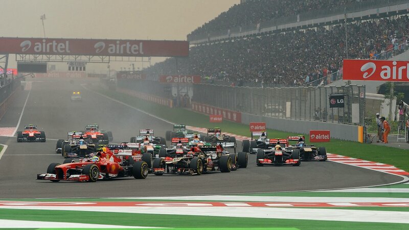 Formula One Cars Racing — Red, Competitive, Afternoon, Photograph, Crowd, Racetrack