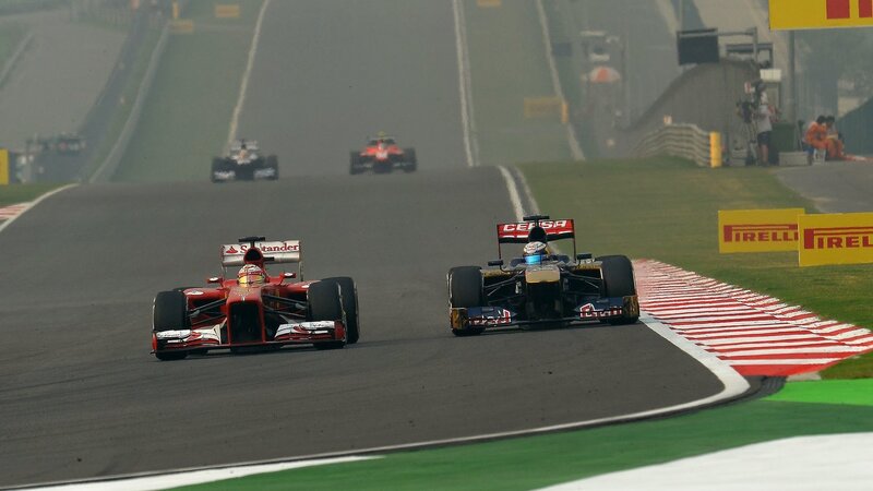 Formula One Cars Racing — Red, Competitive, Photograph, Race Track, Spectators