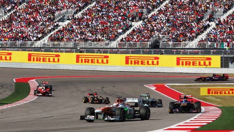 Formula One Cars Racing — Yellow, Dynamic, Afternoon, Photograph, Crowd