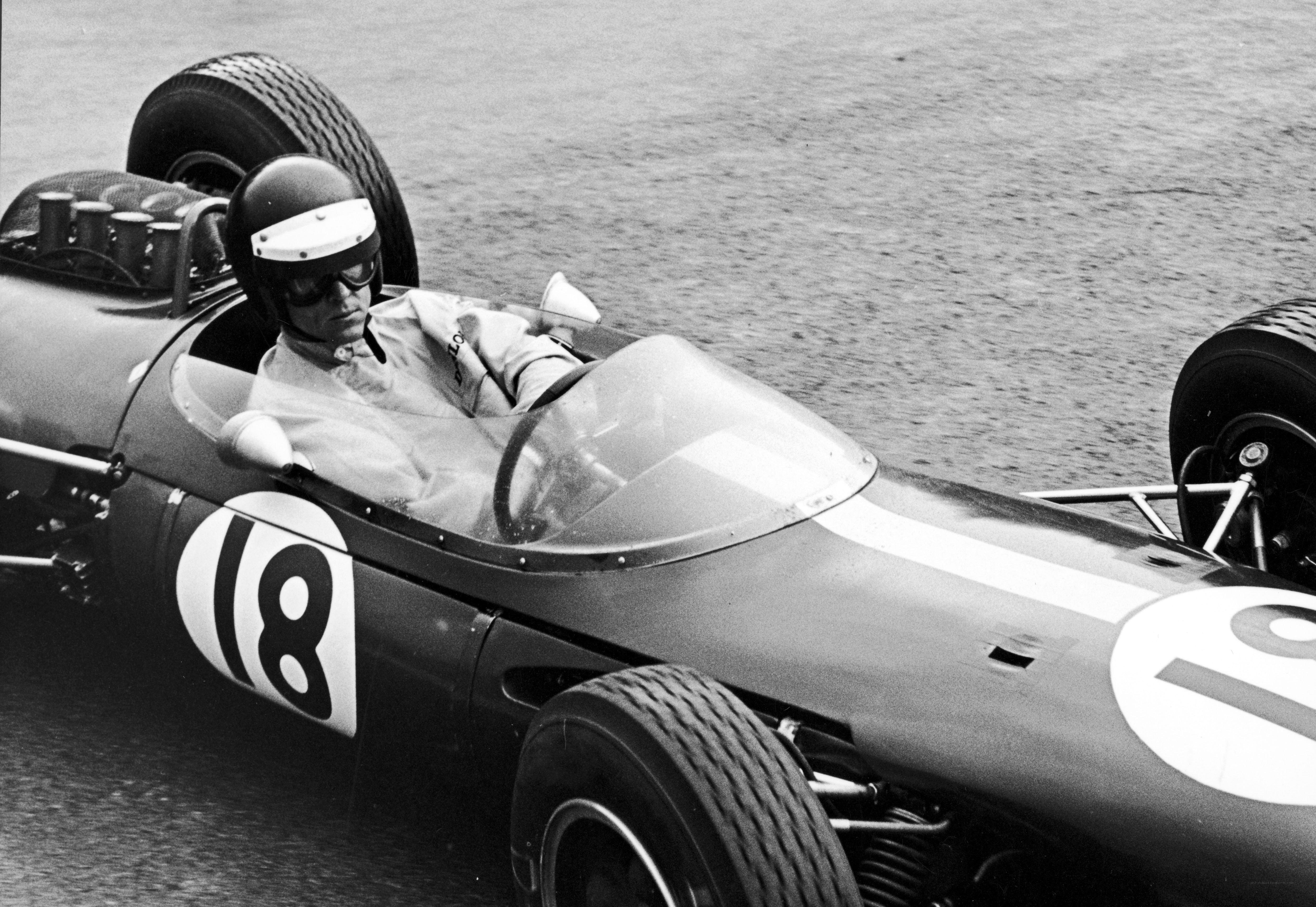 Formula One driver in vintage car