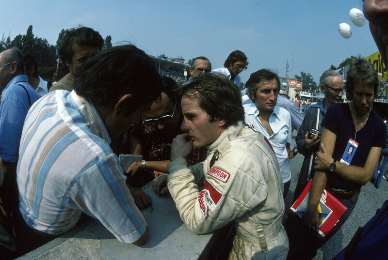 Formula One driver signing autographs