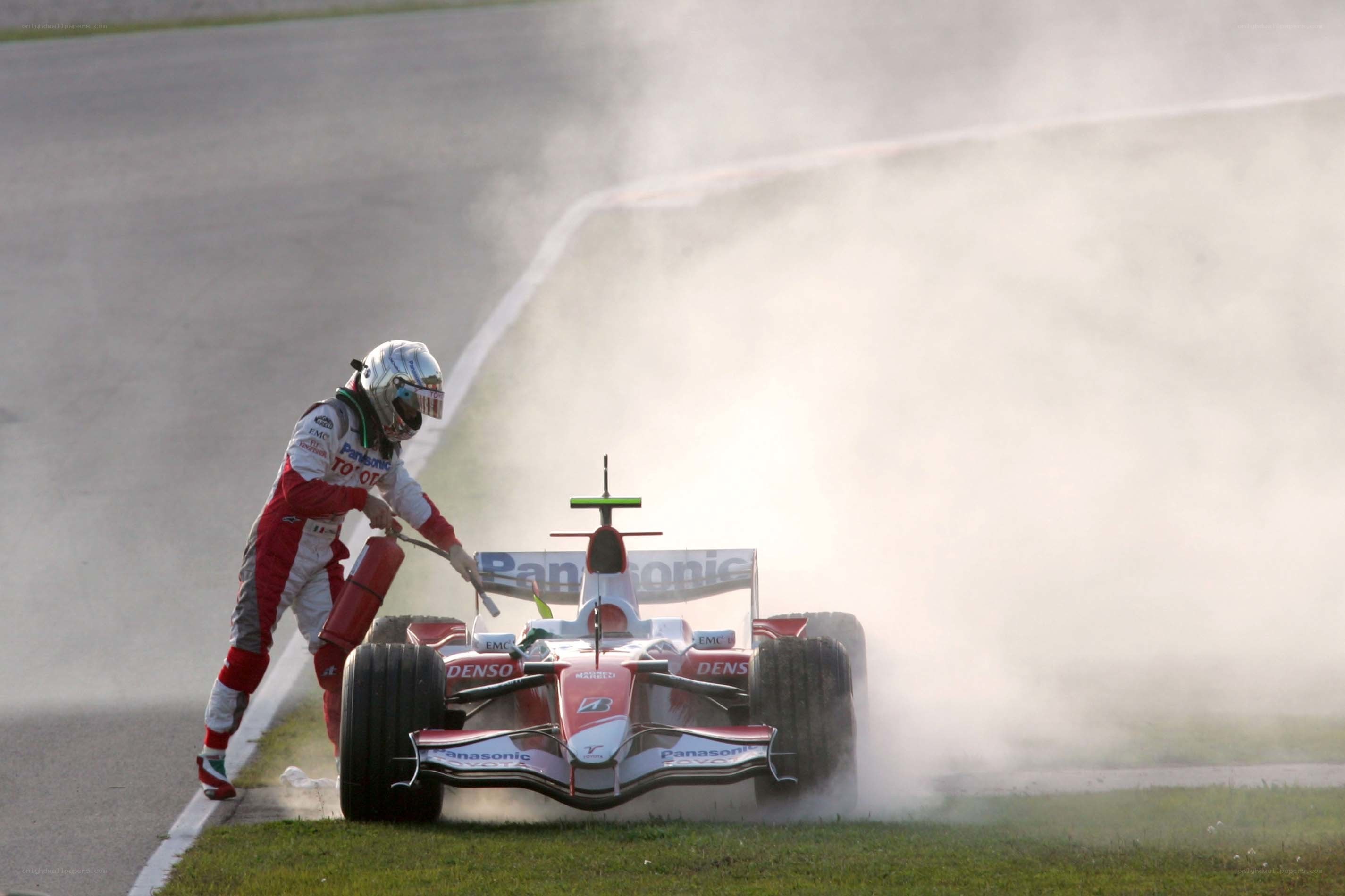 Formula One driver with fire extinguisher