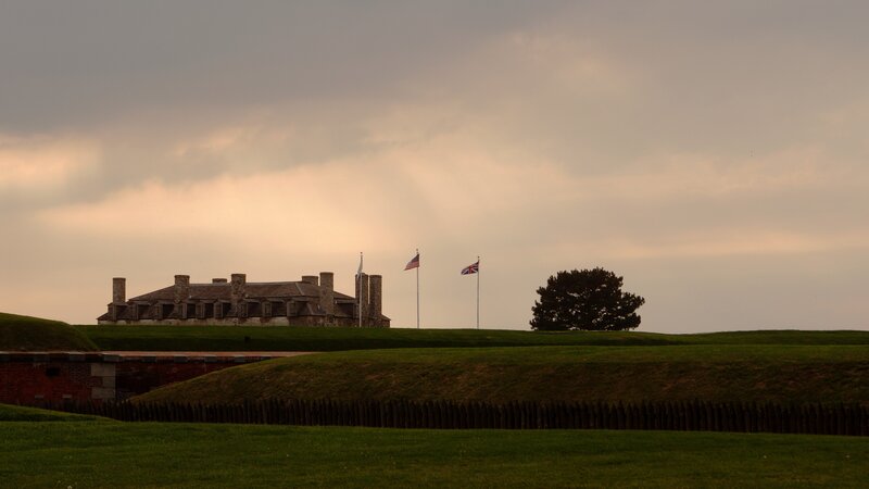 Fort at sunset with flags