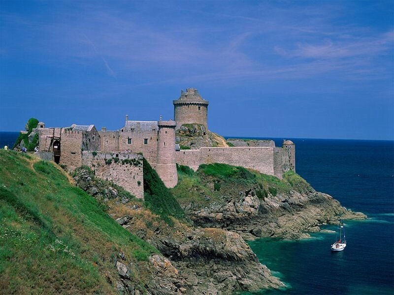 Fortified castle on coastal cliff