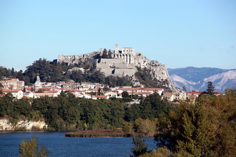 Fortified hilltop town by a lake
