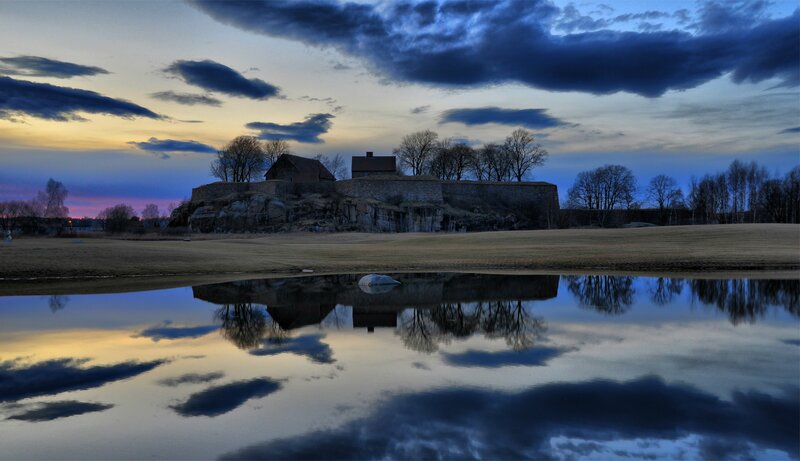 Fortress at dusk with reflection