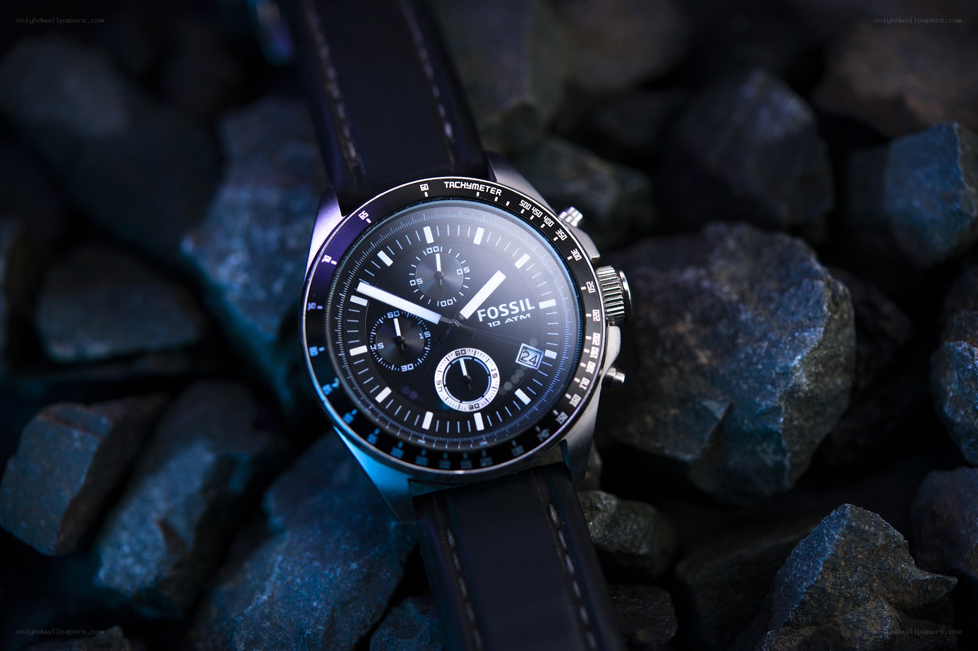 Fossil chronograph watch on rocks