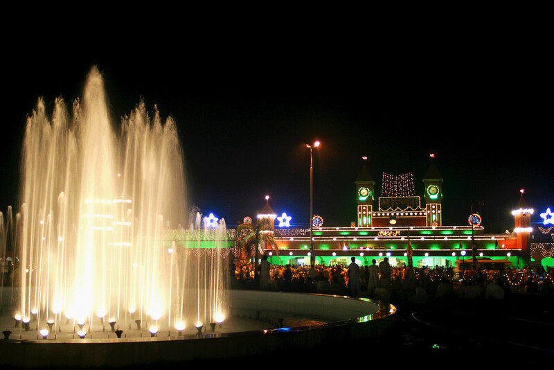 Fountain and illuminated building at night