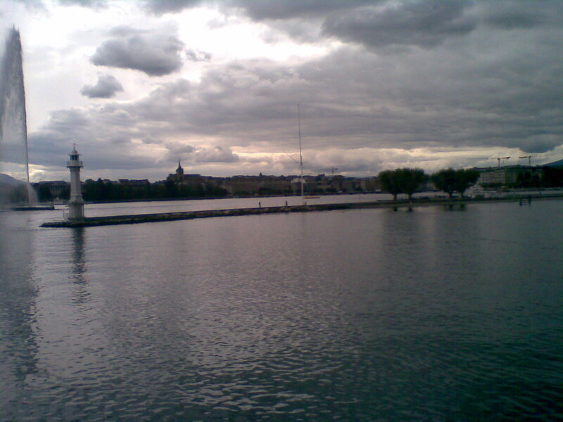 fountain and lighthouse on lake
