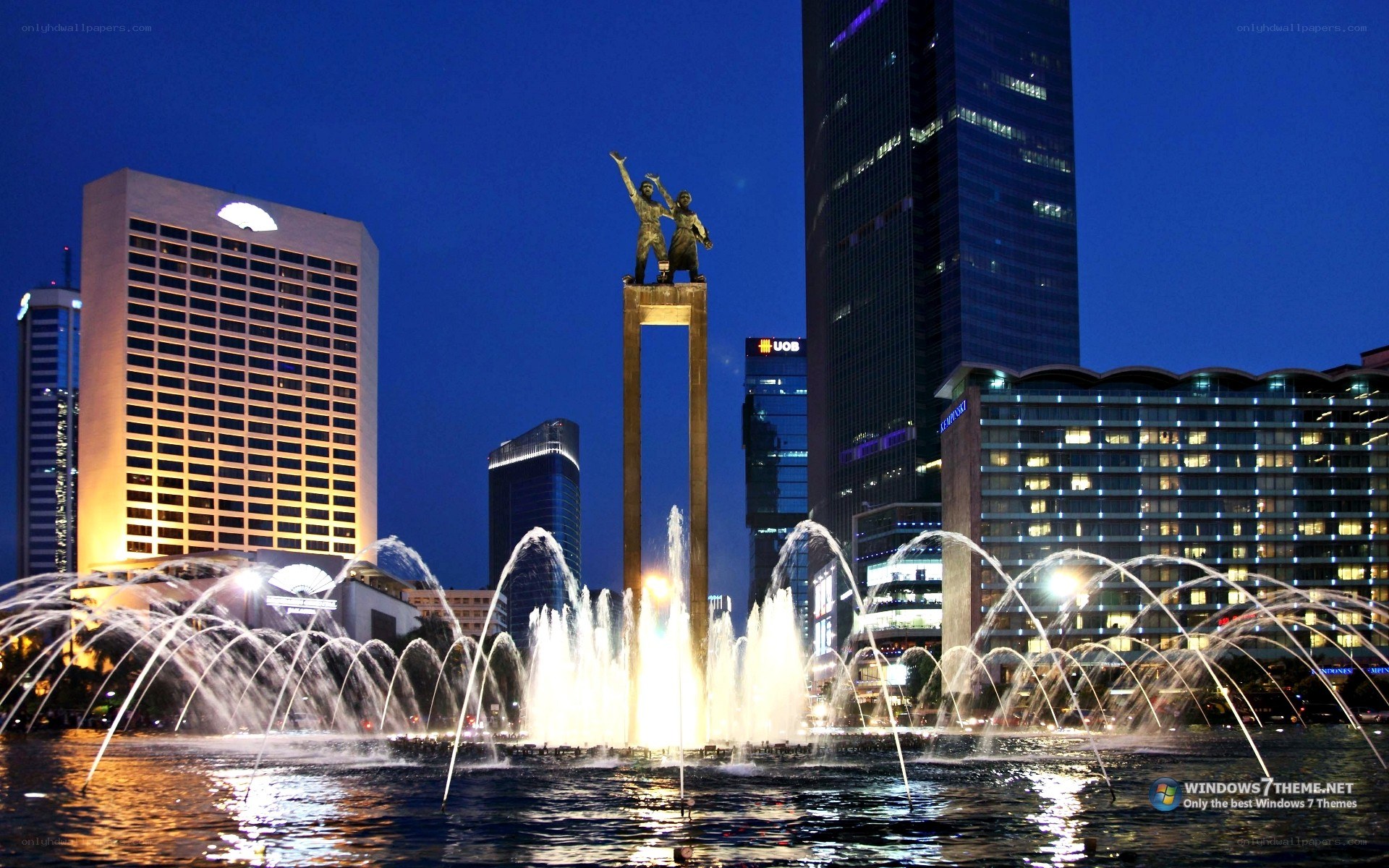 fountain and monument at night