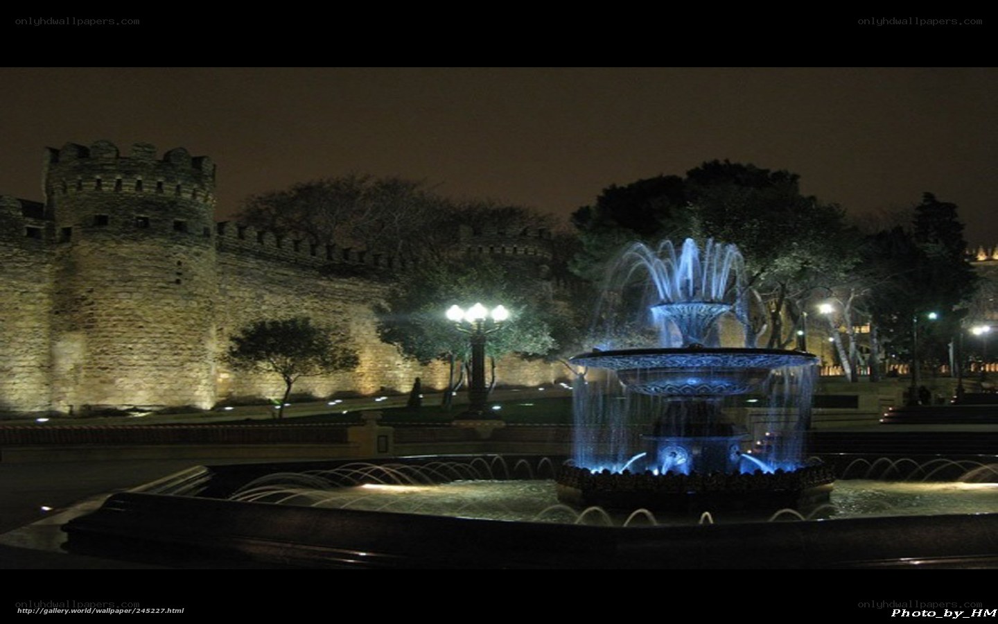 Fountain at night by castle
