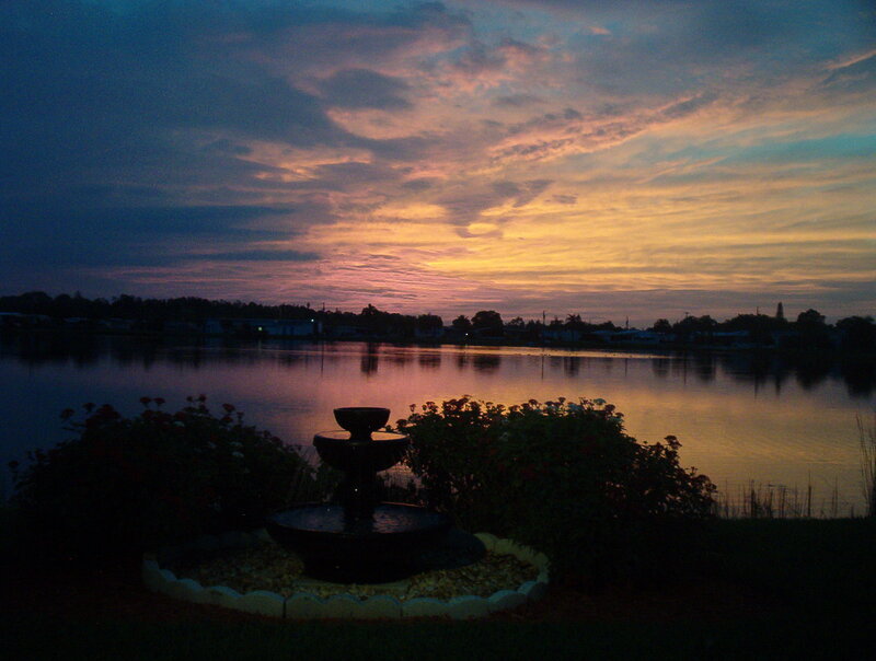 Fountain by Lake at Dusk