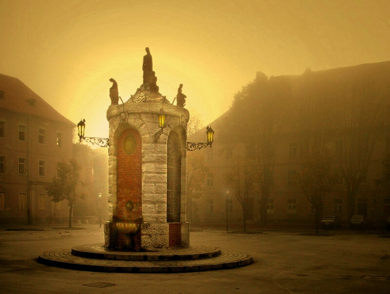Fountain in a misty square