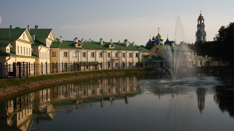 fountain in front of historic buildings