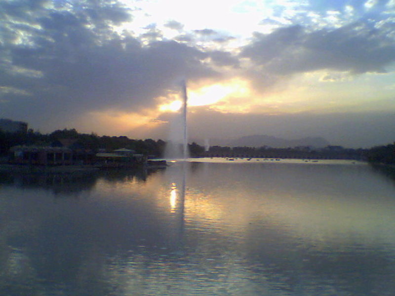 Fountain in Lake at Sunset