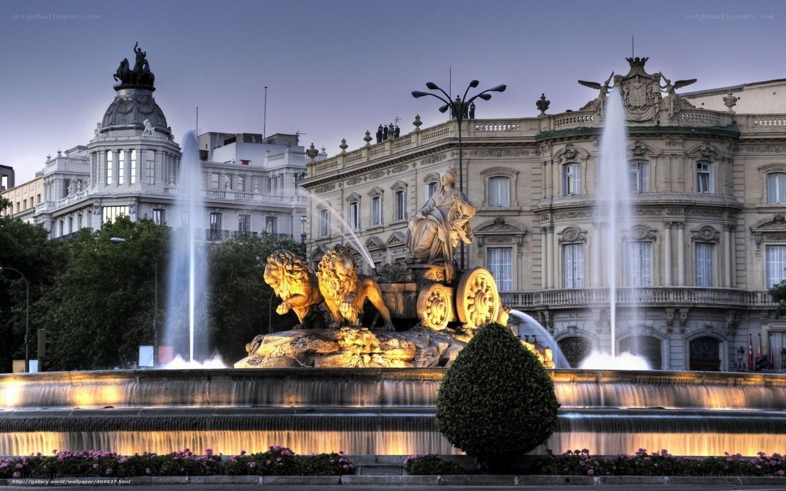 fountain in madrid at dusk