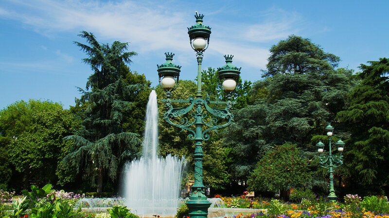Fountain in Park — Green, Serene, Afternoon, Photograph, Lampposts