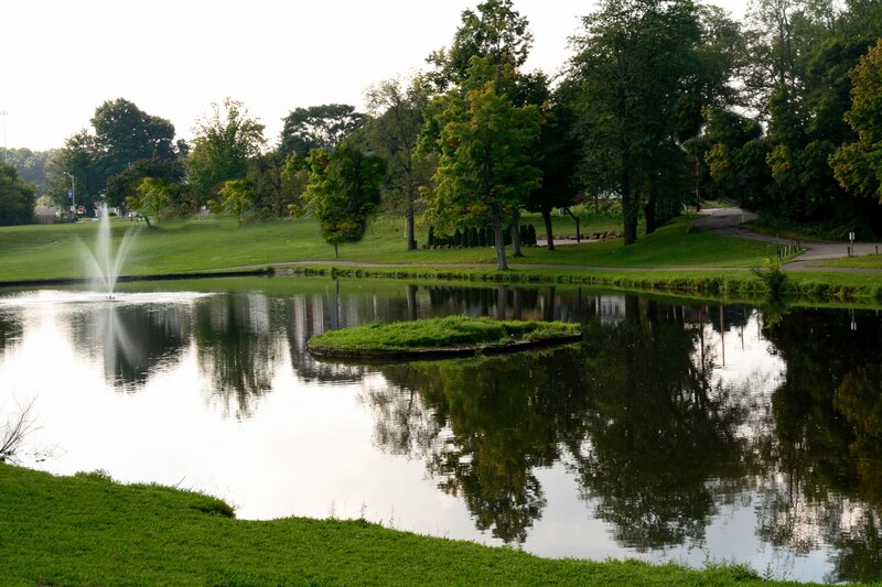 Fountain in Park Pond — Green, Serene, Afternoon, Photograph, Trees