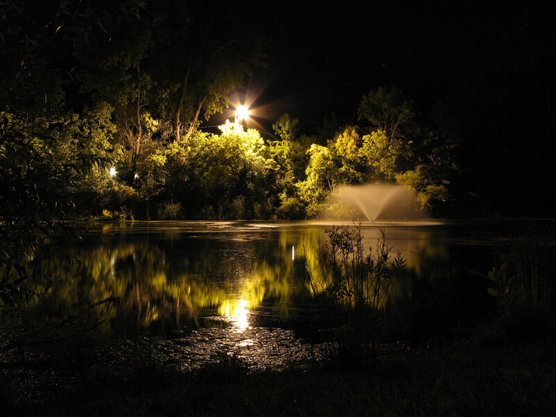 Fountain in Pond at Night