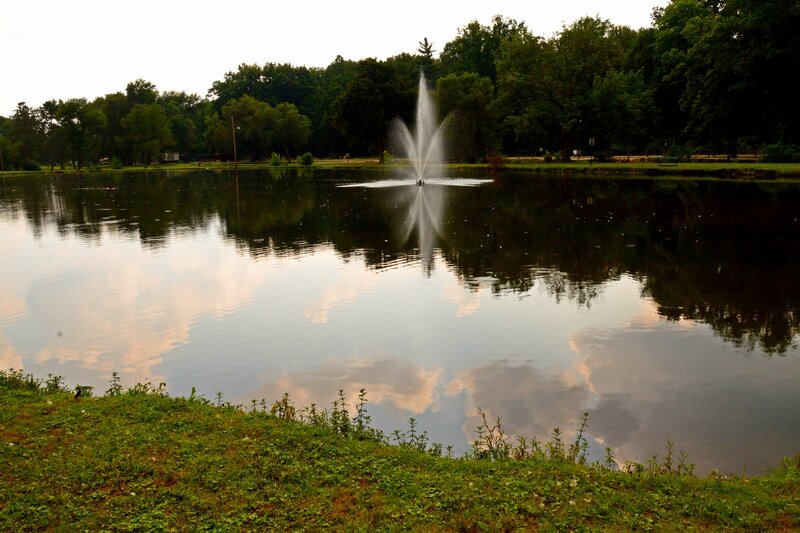 Fountain in Pond — Green, Serene, Sunset