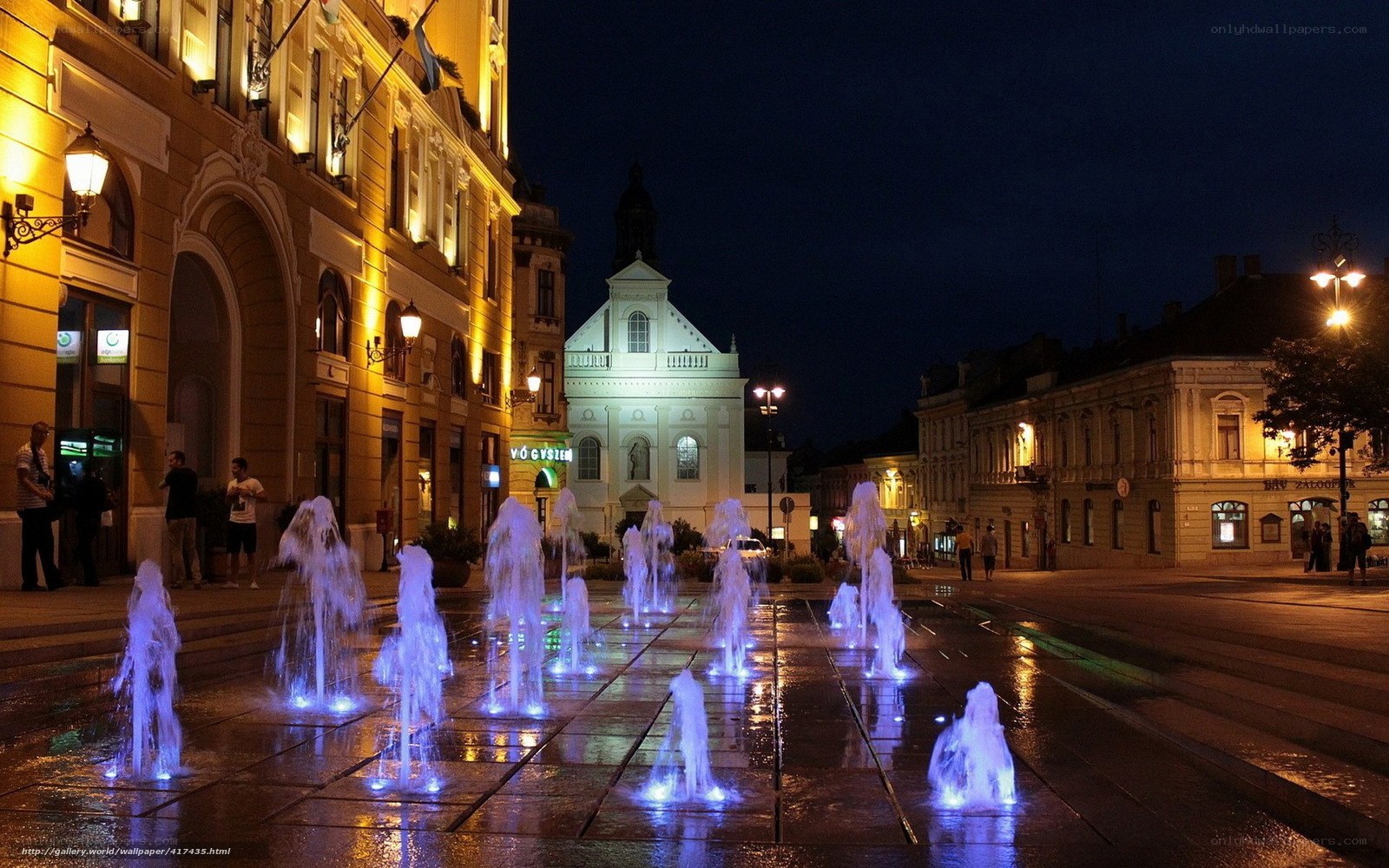 Fountain in town square at night