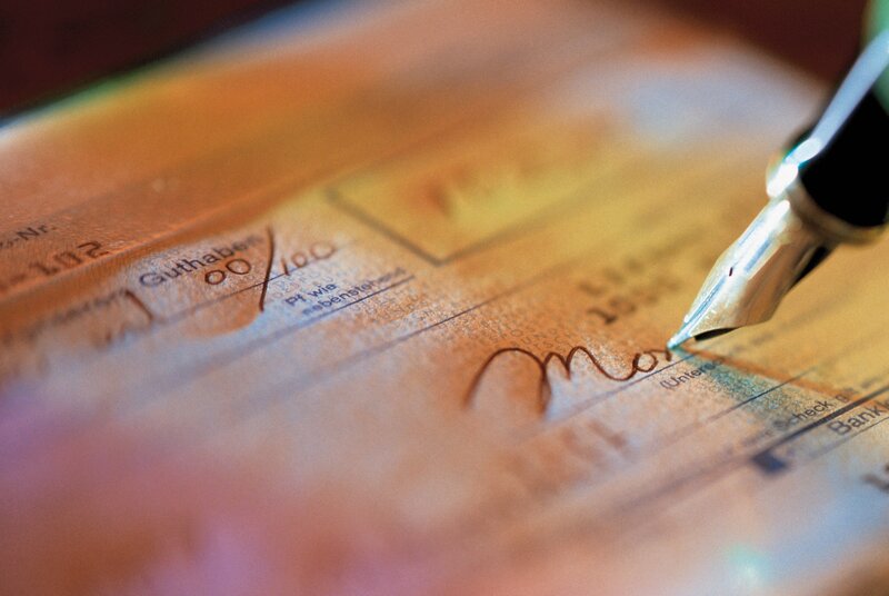 Fountain pen signing a check