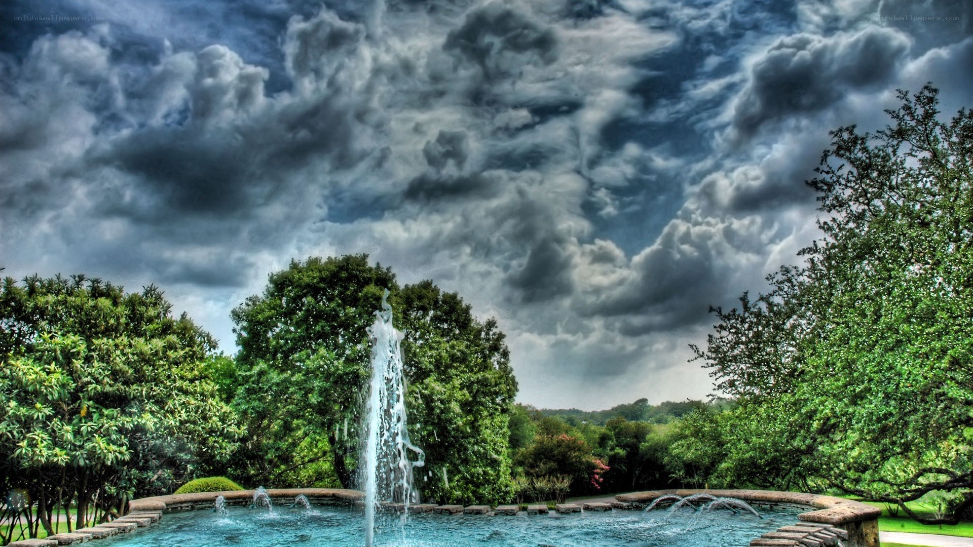 Fountain under stormy sky