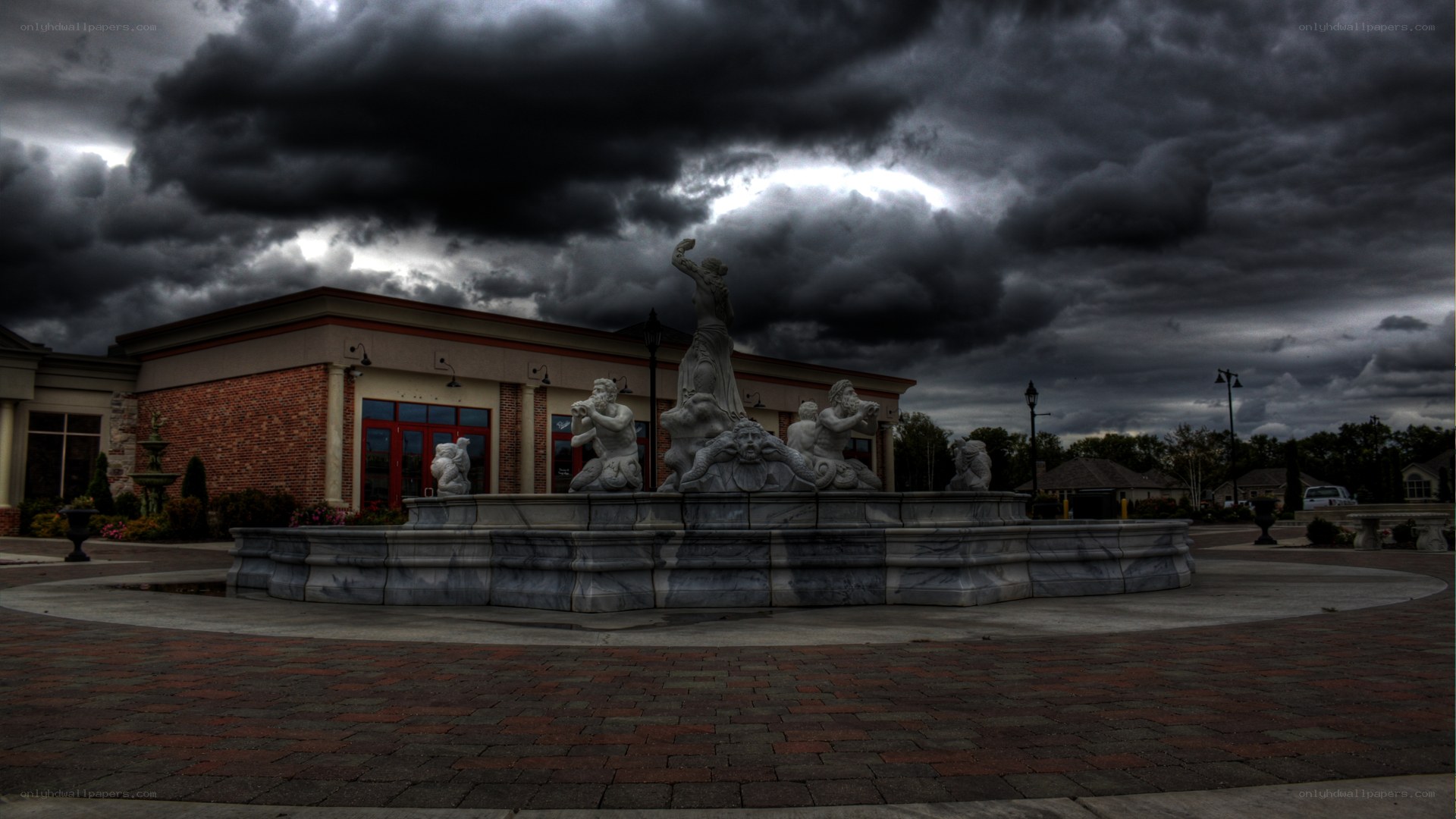 fountain under stormy sky