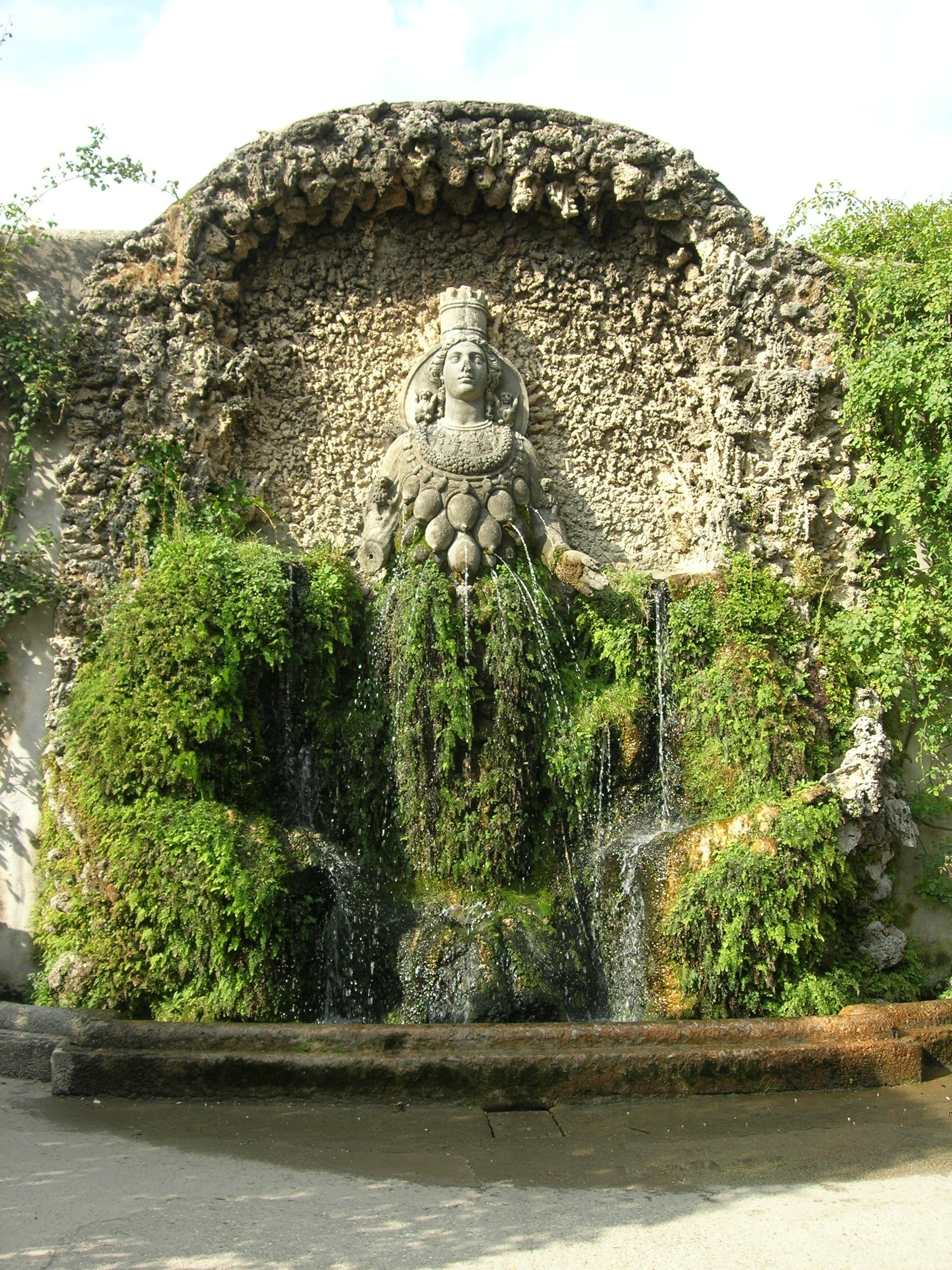 fountain with statue and waterfall