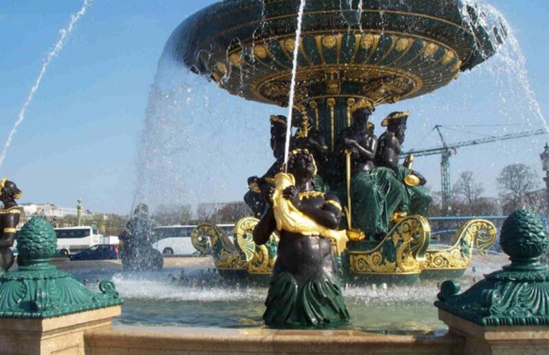 fountain with statues and water