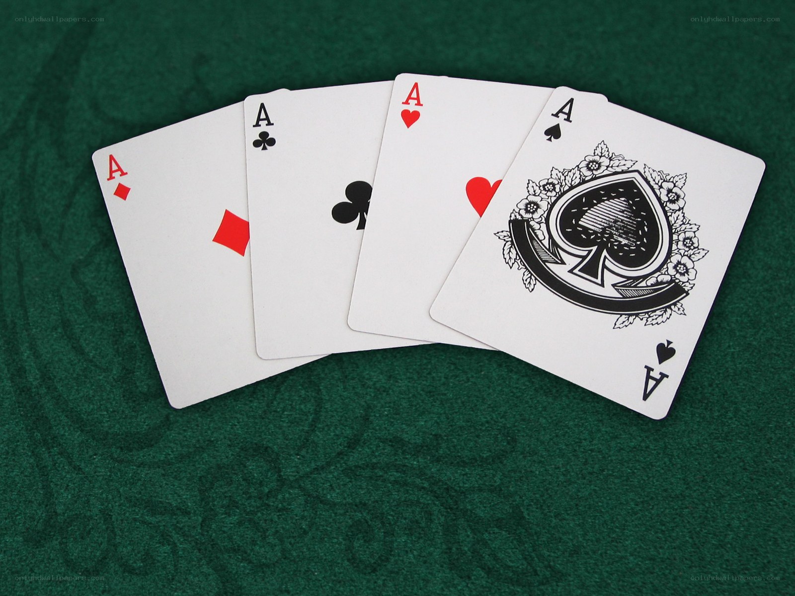 Four aces on green felt