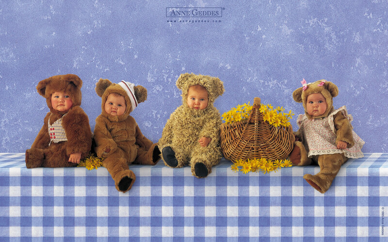 Four Babies in Bear Costumes
