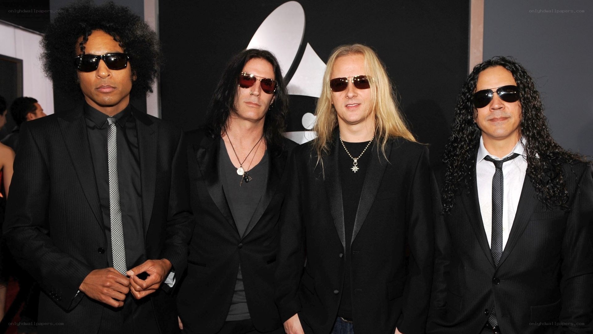 Four band members at an awards show