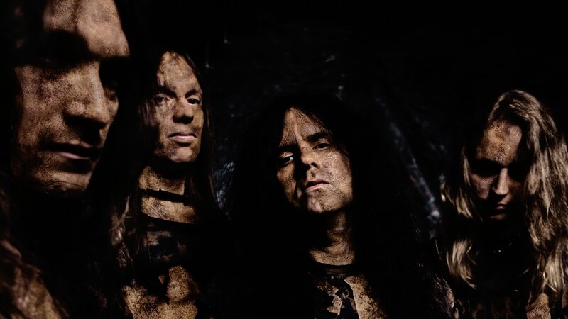 Four Band Members in Dark Setting