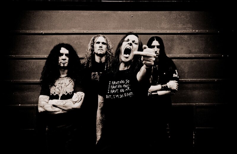 Four Band Members Posing — Black, Intense