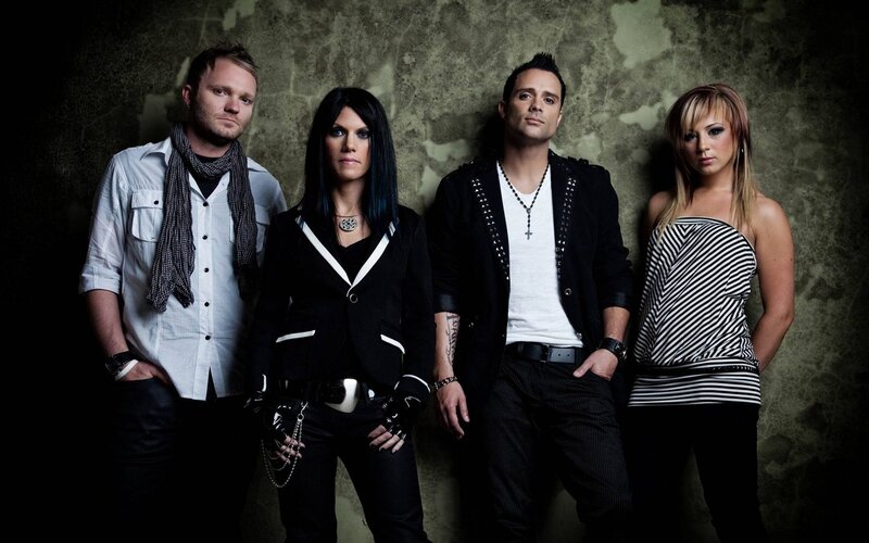 Four Band Members Posing — Black, Serious, Photograph