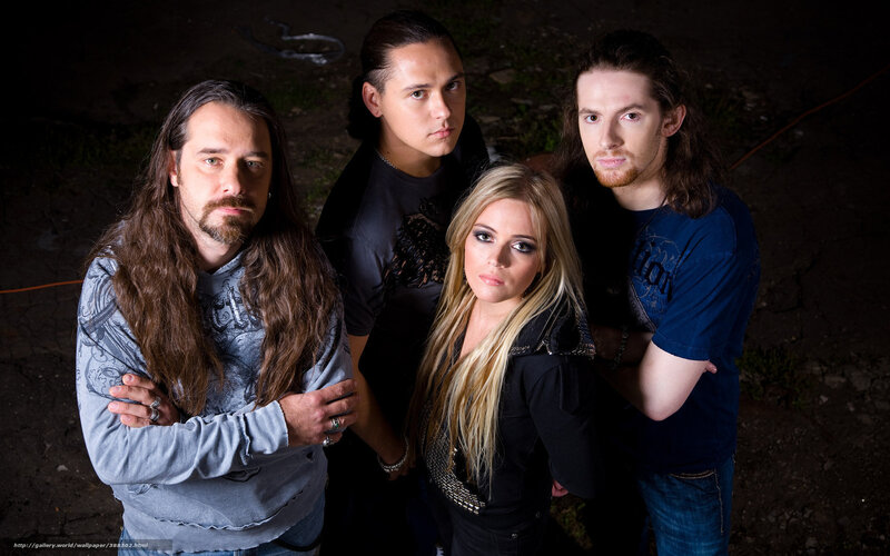 Four Band Members Posing — Black, Serious