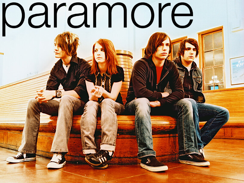 Four Band Members Sitting