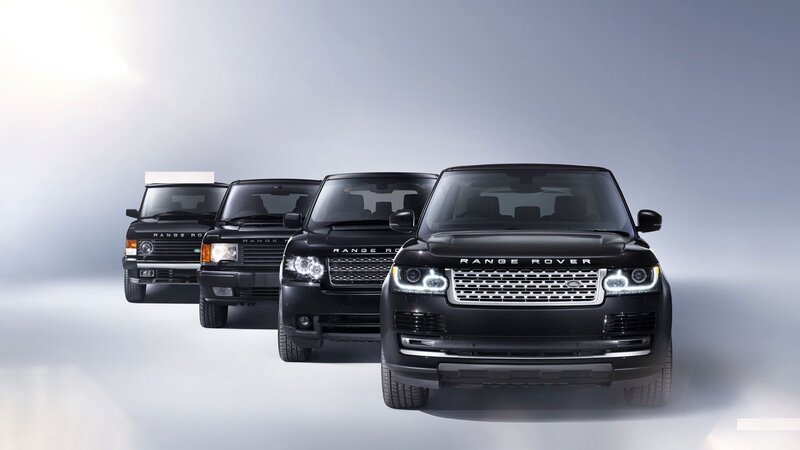 Four Black Range Rover Vehicles — Dramatic, Photograph