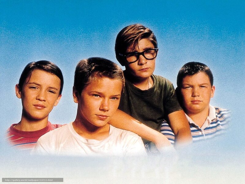 four boys in front of blue sky