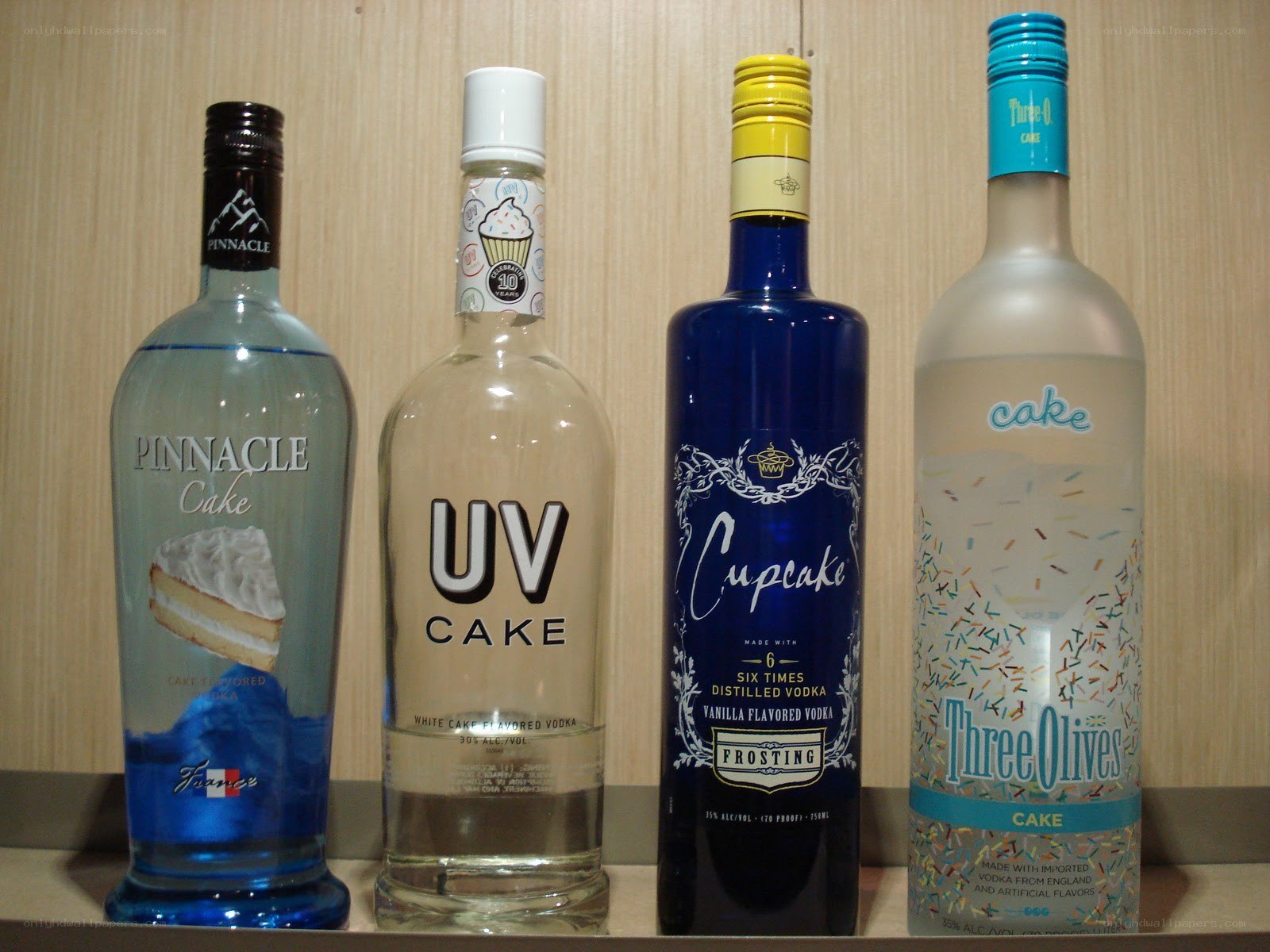 Four cake-flavored vodka bottles