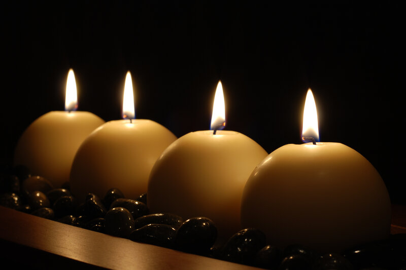 Four Candles on Pebbles
