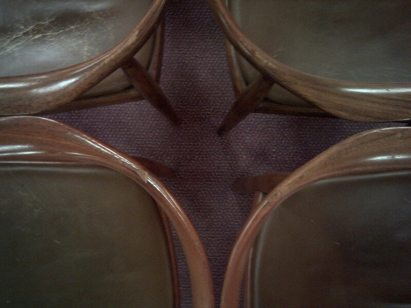 four chairs on carpet
