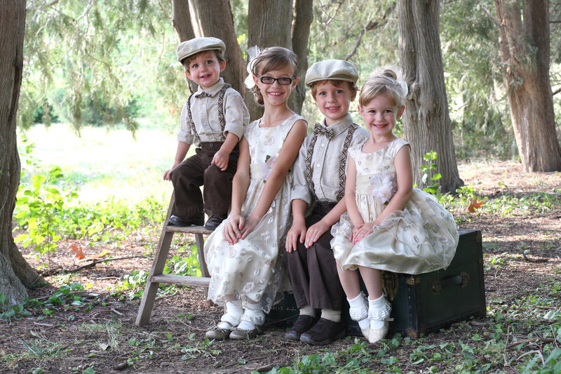 Four Children in Vintage Clothes